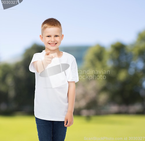 Image of smiling little boy in white blank t-shirt