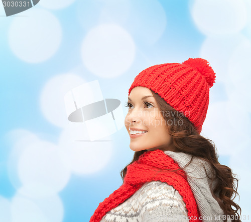 Image of smiling young woman in winter clothes