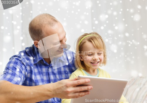 Image of happy father and daughter with tablet pc computer