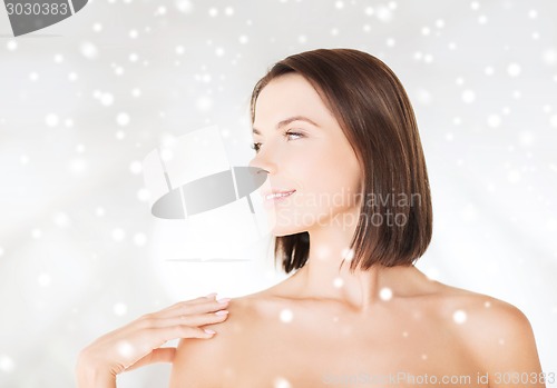 Image of beautiful woman standing in towel