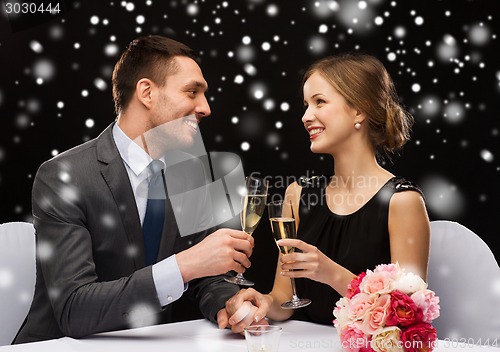 Image of smiling couple at restaurant