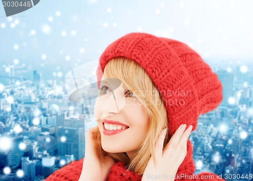 Image of smiling young woman in winter clothes