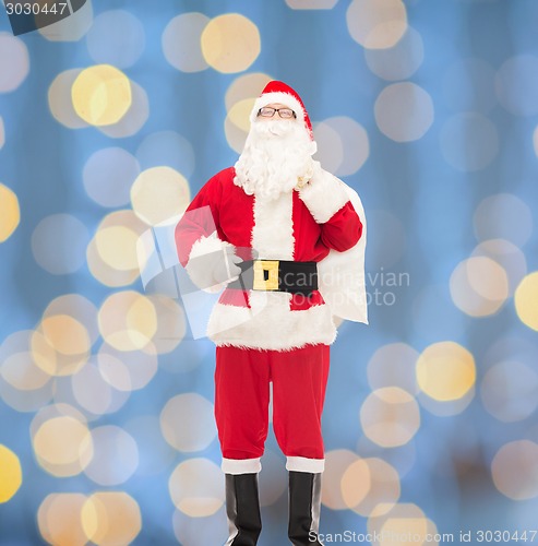 Image of man in costume of santa claus with bag