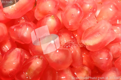 Image of Photo of the juicy red pomegranate seeds