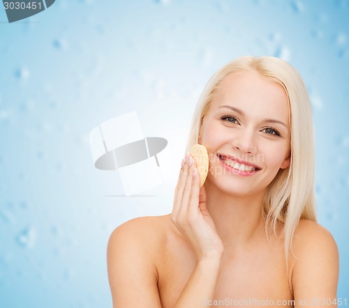 Image of beautiful woman with sponge