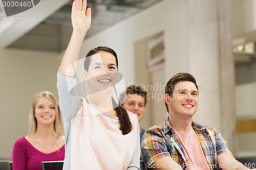 Image of group of smiling students in lecture hall