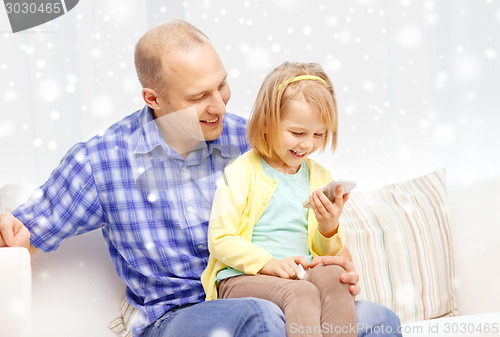 Image of happy father and daughter with smartphone