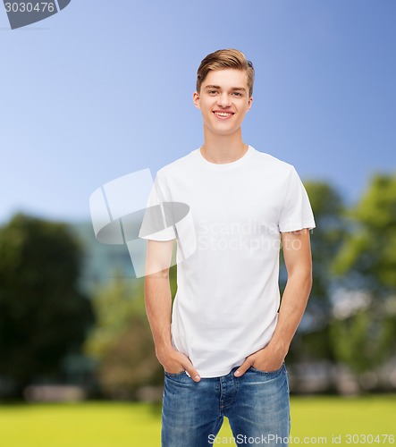 Image of smiling young man in blank white t-shirt
