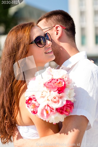 Image of smiling couple in city