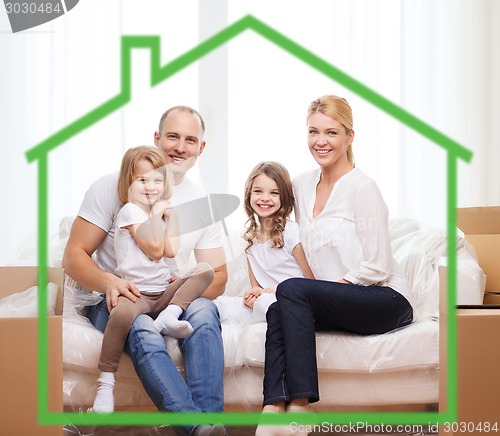 Image of smiling parents and two little girls at new home