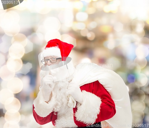 Image of man in costume of santa claus with bag