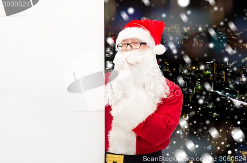 Image of man in costume of santa claus with billboard