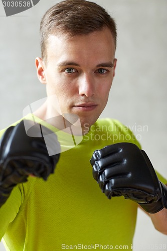 Image of young man in boxing gloves