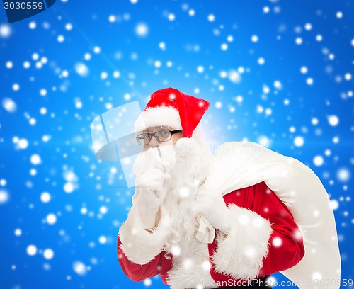 Image of man in costume of santa claus with bag