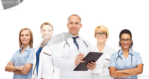 Image of group of smiling doctors with clipboard