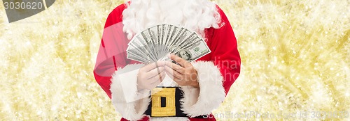 Image of close up of santa claus with dollar money