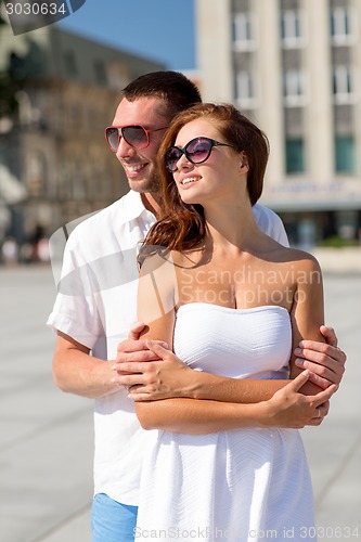 Image of smiling couple in city