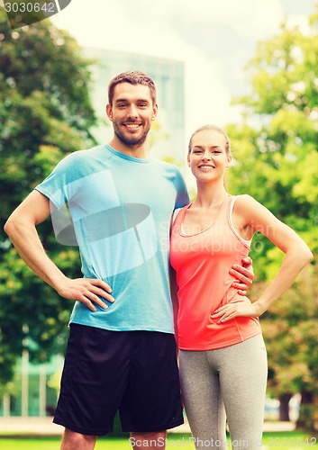 Image of smiling couple outdoors
