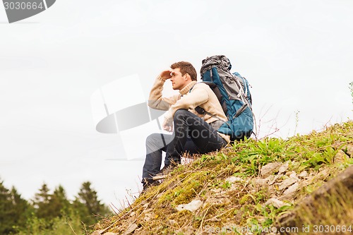 Image of man with backpack hiking