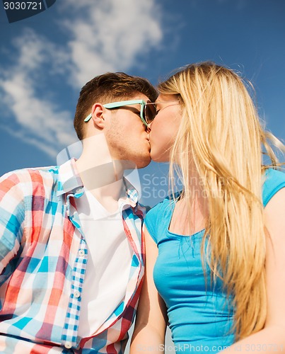 Image of smiling couple outdoors