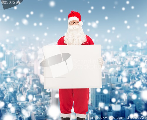 Image of man in costume of santa claus with billboard