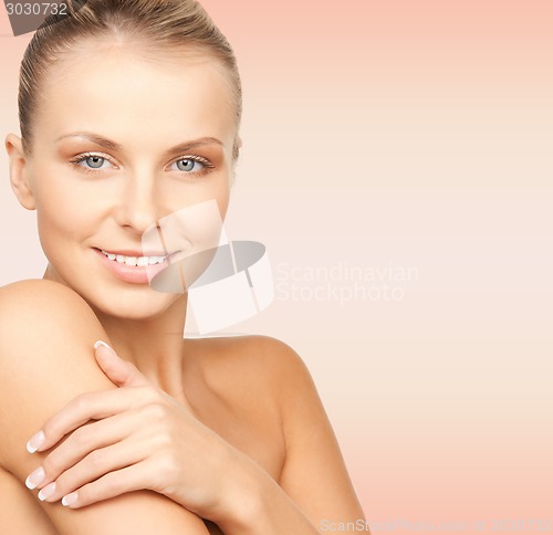 Image of beautiful young woman with bare shoulders