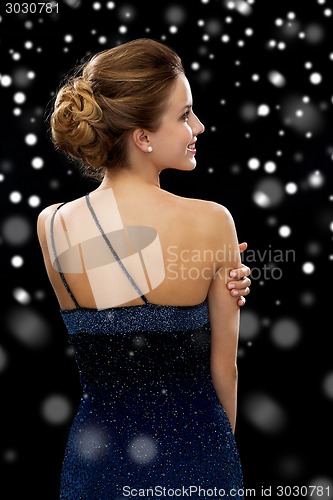 Image of smiling woman in evening dress