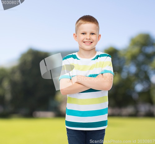 Image of little boy in casual clothes with arms crossed