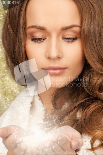 Image of close up of smiling young woman in winter clothes