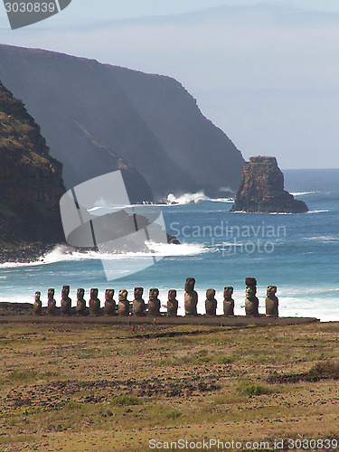 Image of Row Of Moai Against The Ocean