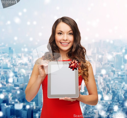 Image of smiling woman with tablet pc