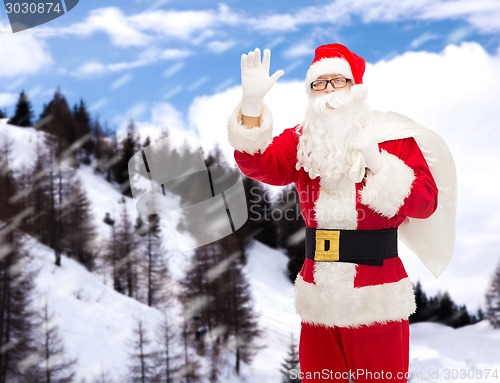 Image of man in costume of santa claus with bag