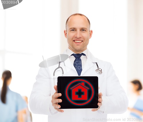 Image of smiling male doctor with stethoscope and tablet pc