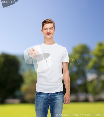 Image of smiling young man in blank white t-shirt