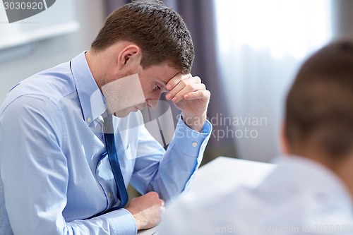 Image of business people having problem in office