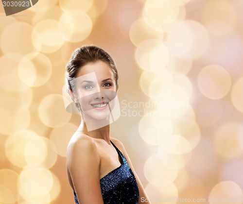 Image of smiling woman in evening dress