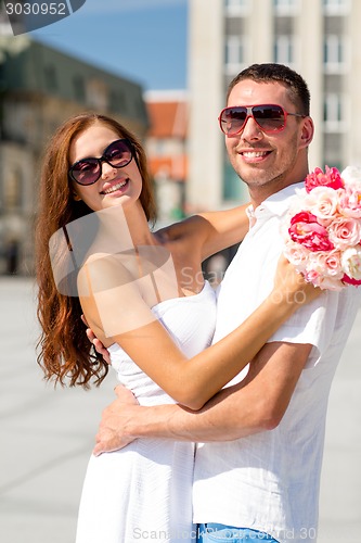 Image of smiling couple in city