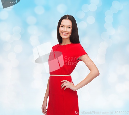 Image of smiling woman in red dress