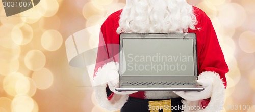 Image of close up of santa claus with laptop