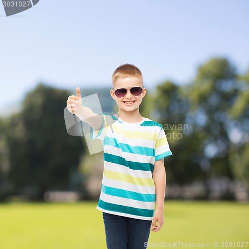 Image of smiling cute little boy in sunglasses