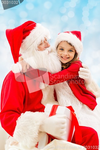 Image of smiling little girl with santa claus