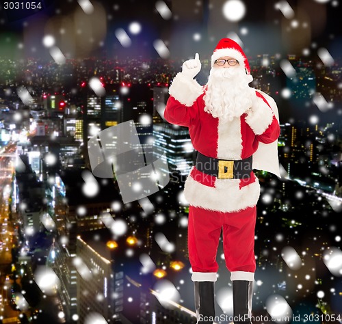 Image of man in costume of santa claus with bag