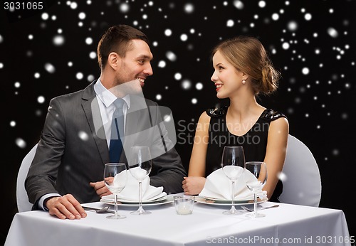 Image of smiling couple at restaurant
