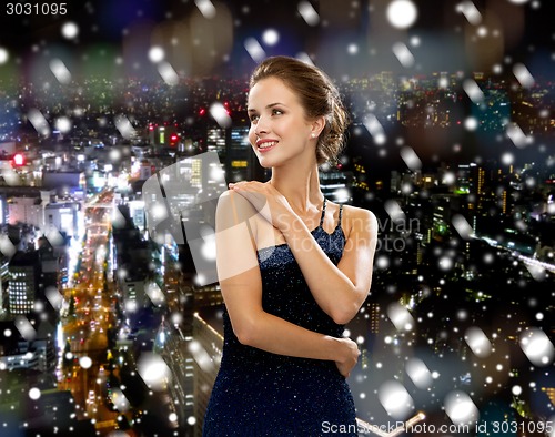 Image of smiling woman in evening dress