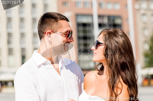 Image of smiling couple in city