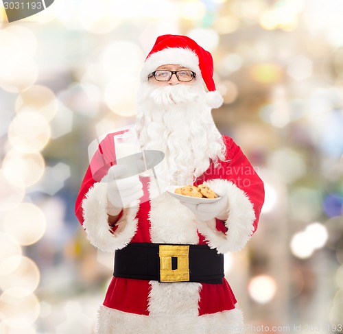 Image of santa claus with glass of milk and cookies