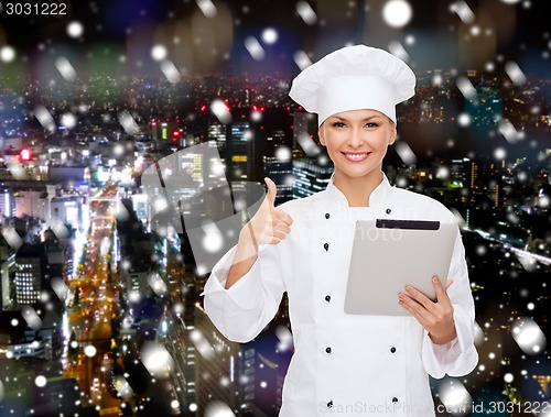 Image of smiling chef with tablet pc showing thumbs up