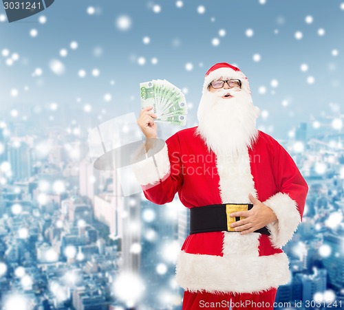 Image of man in costume of santa claus with euro money