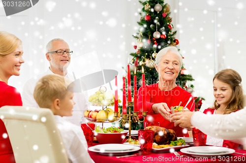 Image of smiling family having holiday dinner at home