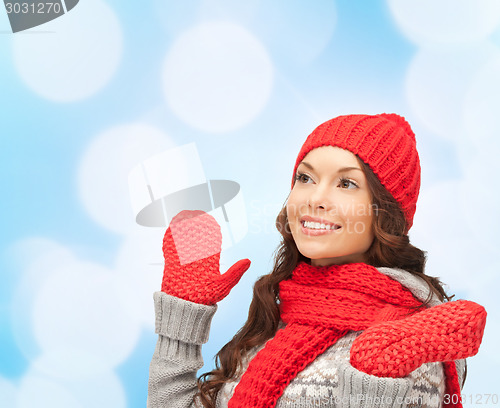 Image of smiling young woman in winter clothes